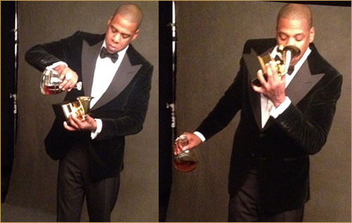 Jay-Z Pouring and Drinking Dusse out of a Grammy trophy. 